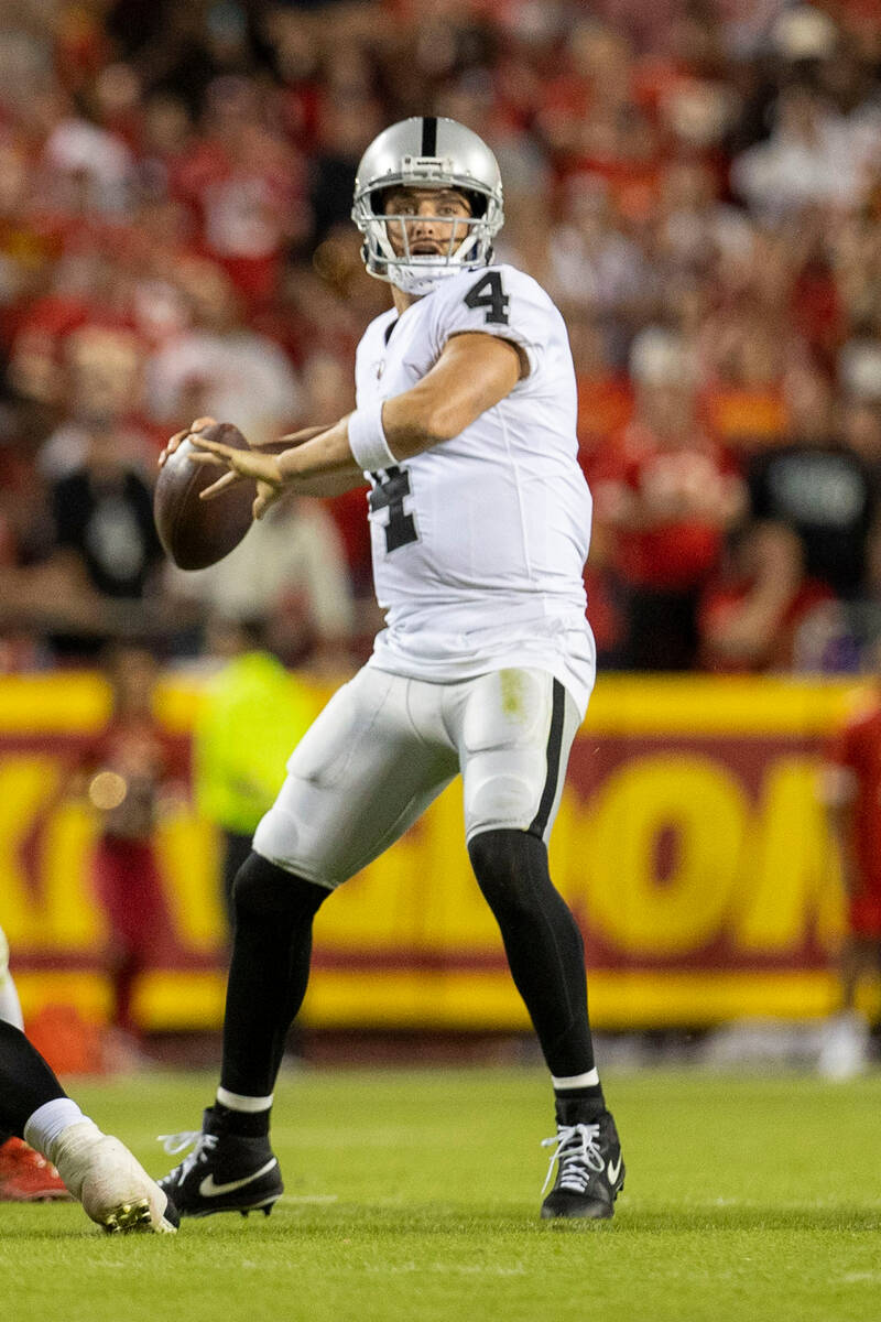 Raiders quarterback Derek Carr (4) makes a throw during the second half of an NFL game against ...