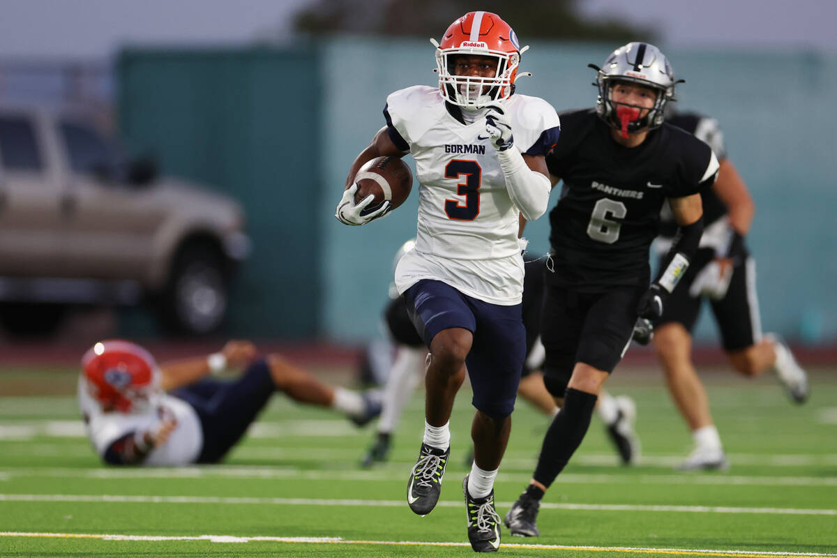 Bishop Gorman's Devon Rice (3) runs the ball for a touchdown during the first half of a footbal ...