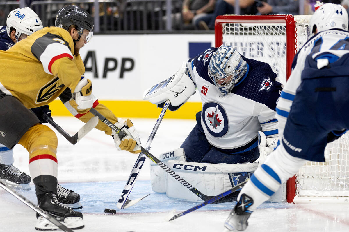 Golden Knights center William Karlsson (71) attempts to score against Jets goaltender David Rit ...