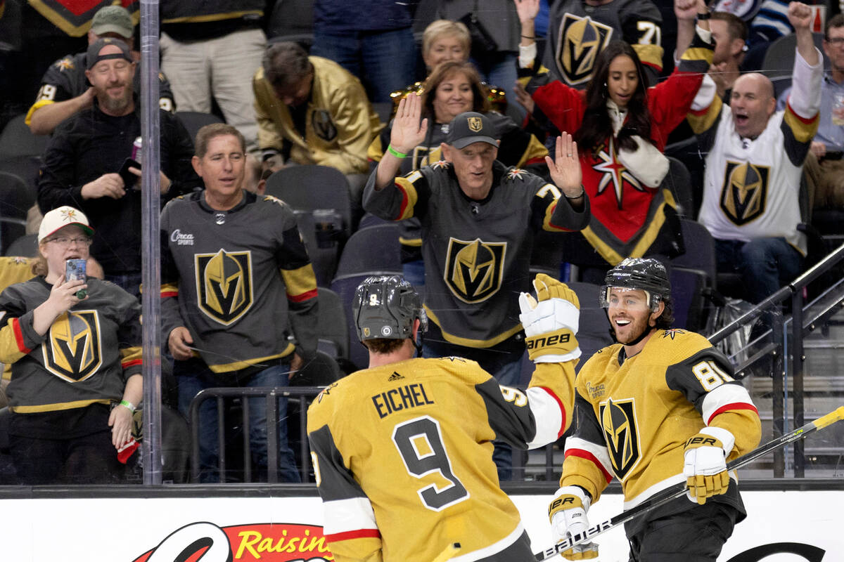 Golden Knights center Jonathan Marchessault (81), center Jack Eichel (9) and their fans celebra ...