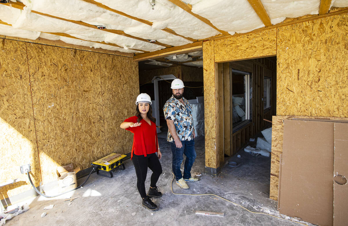 Tiffany Brown, property manager at ShareDOWNTOWN, left, gives a tour to a prospective tenant at ...