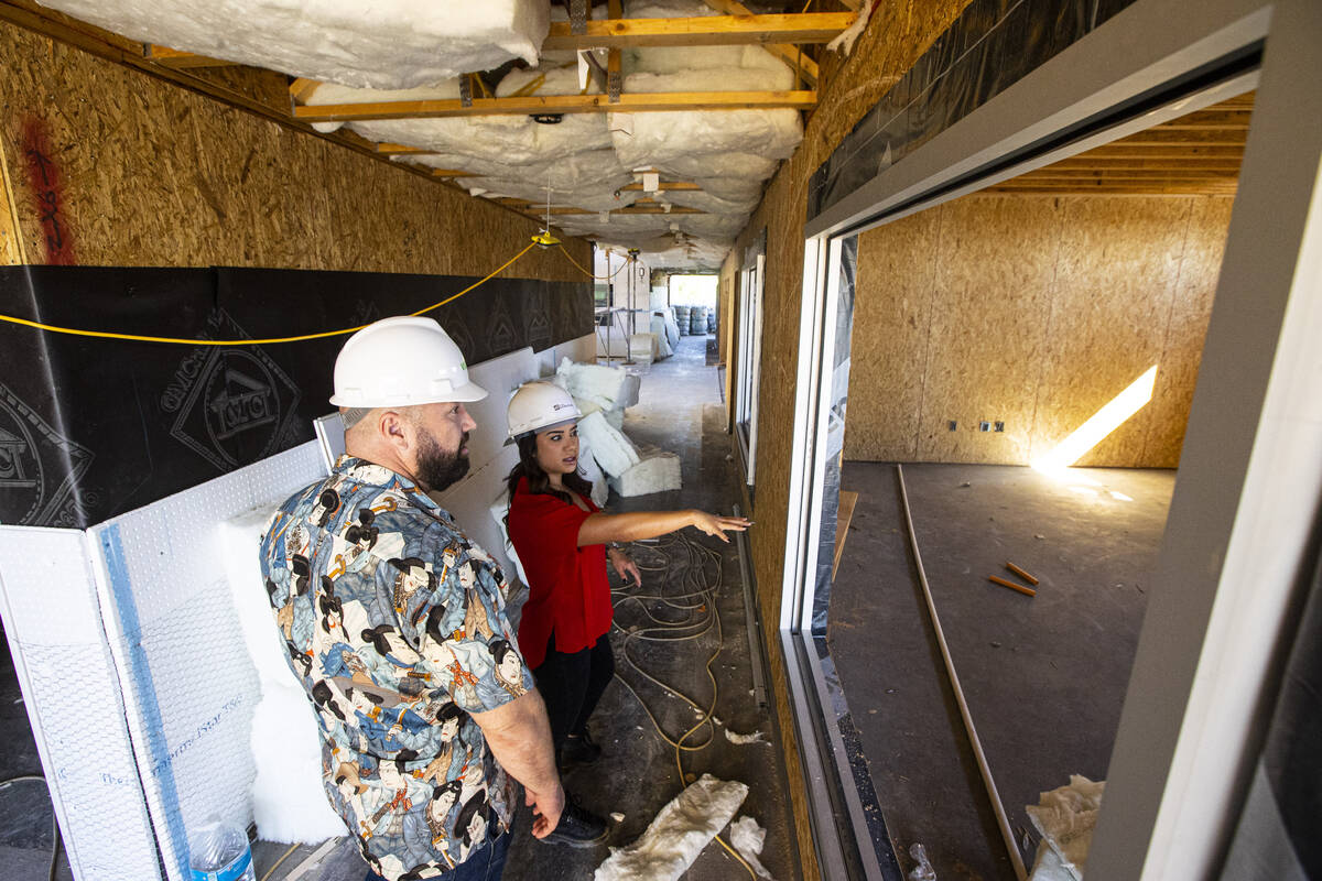 Tiffany Brown, property manager at ShareDOWNTOWN, right, gives a tour to a prospective tenant a ...