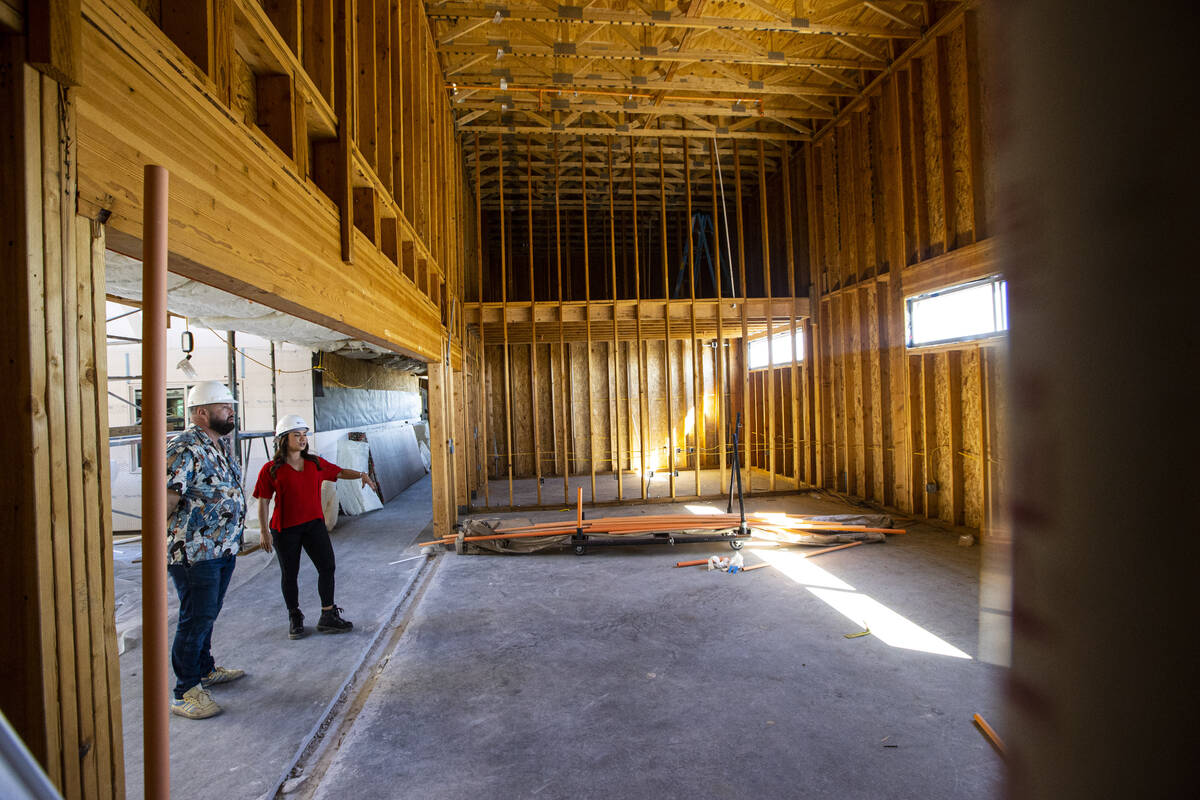 Tiffany Brown, property manager at ShareDOWNTOWN, right, gives a tour to a prospective tenant a ...