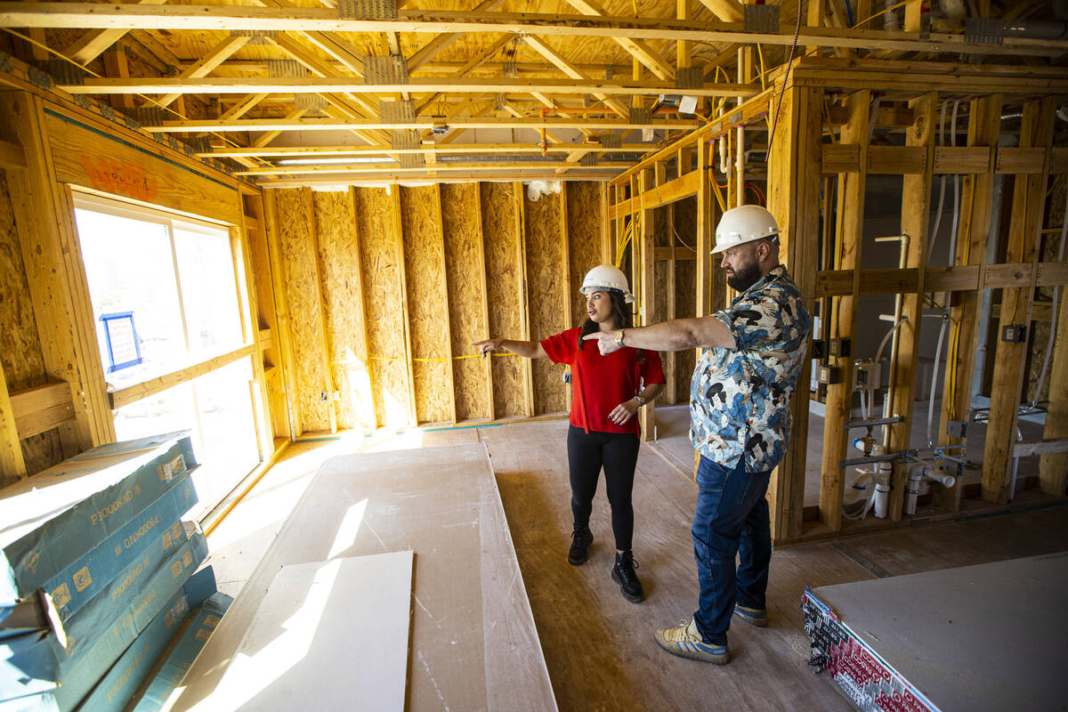 Tiffany Brown, property manager at ShareDOWNTOWN, left, gives a tour to a prospective tenant at ...