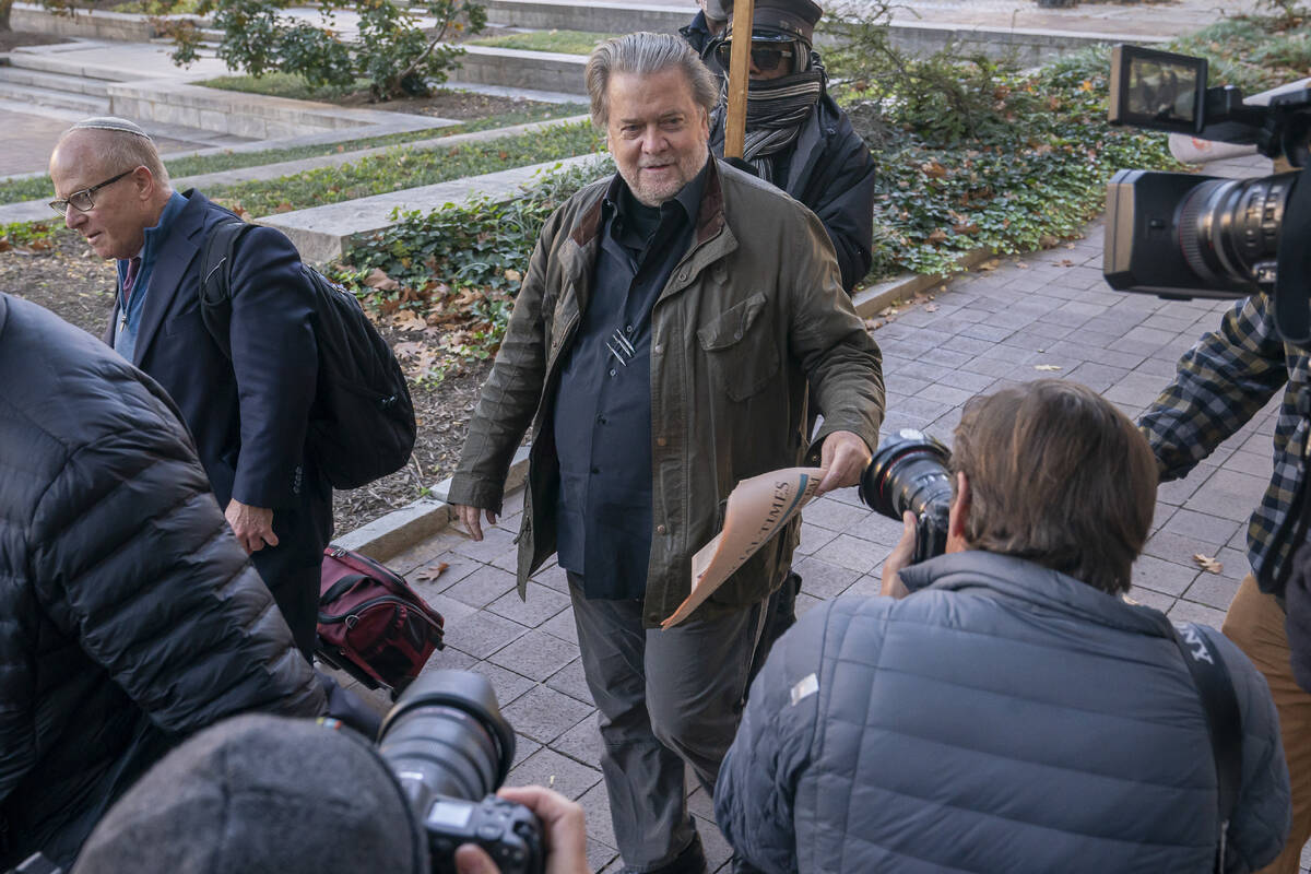 Steve Bannon, center, a longtime ally of former President Donald Trump, convicted of contempt o ...