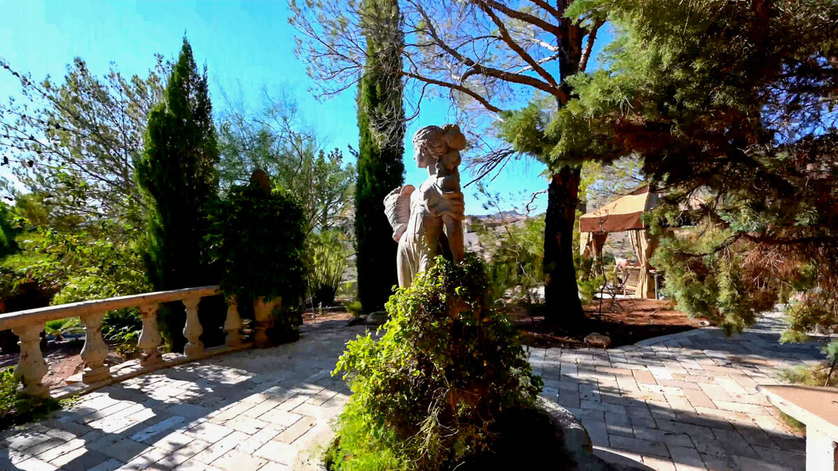 A tall white statue depicting one the writer's beloved characters, Kahlan Amnell, stands guard ...