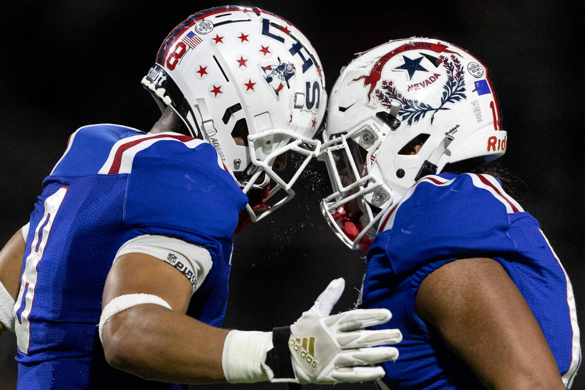 Liberty’s Jae Beasley (8) and Sonny Vitale, right, celebrate after Beasley made a key sa ...