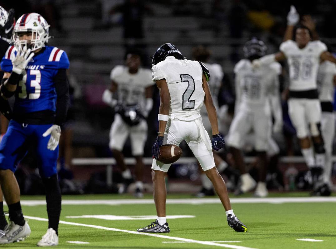 Desert Pines’ Isiah Nickles (2) celebrates after catching an interception during a Class ...