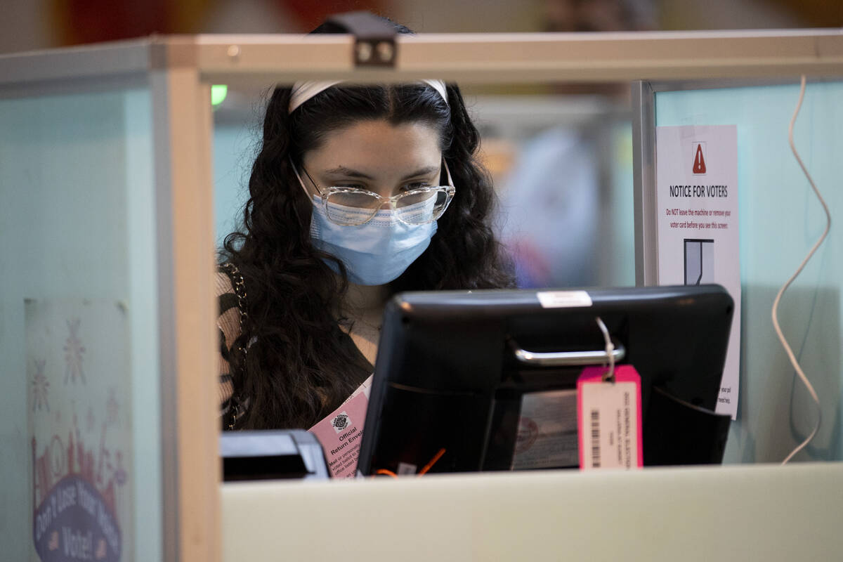 Amira Ezzarhri, 18, casts her vote at the polling place inside of the Galleria at Sunset shoppi ...