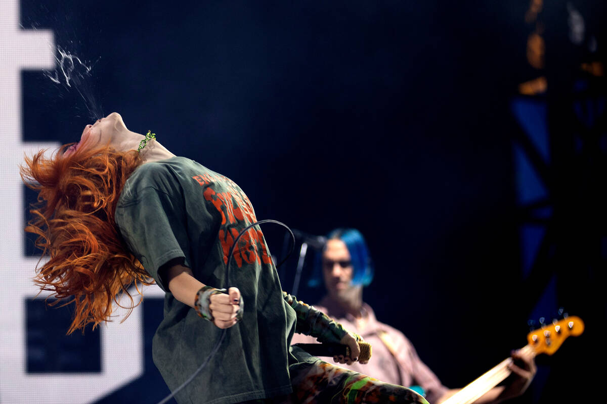 Paramore’s lead singer Hayley Williams spits water in the middle of her set during When ...