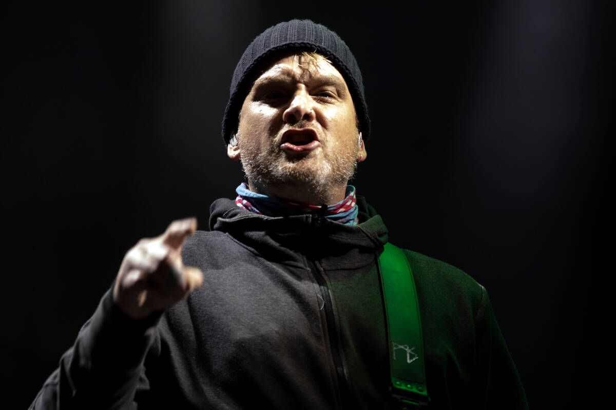 Alkaline Trio’s Matt Skiba points to a group of heavily dancing fans during When We Were ...