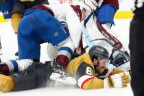 Vegas Golden Knights right wing Mark Stone (61) gets tripped by Colorado Avalanche center Natha ...