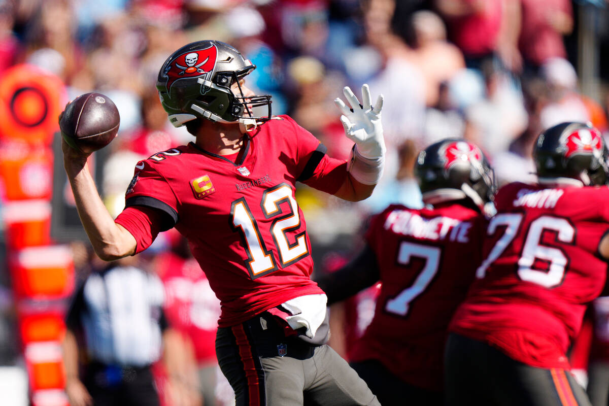 Tampa Bay Buccaneers quarterback Tom Brady (12) looks to pass during the first half of an NFL f ...