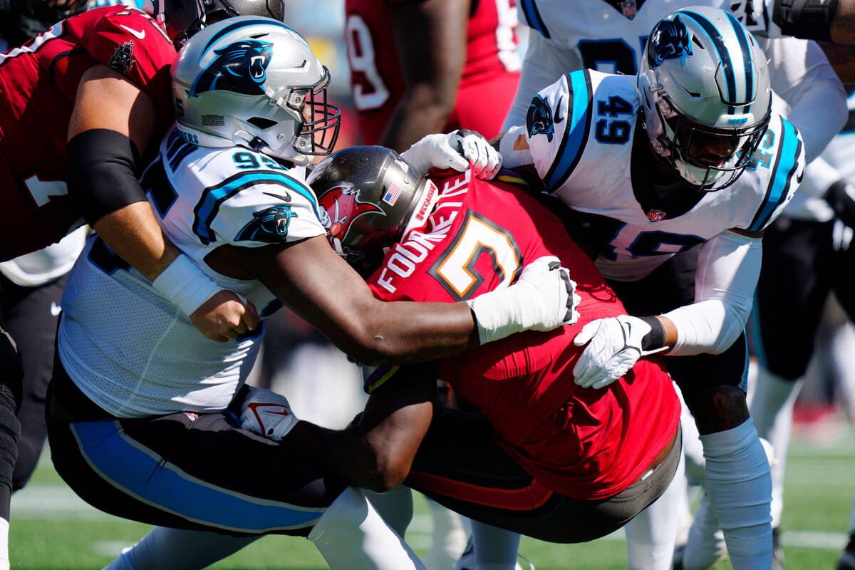 Tampa Bay Buccaneers running back Leonard Fournette (7) is tackled by Carolina Panthers defensi ...