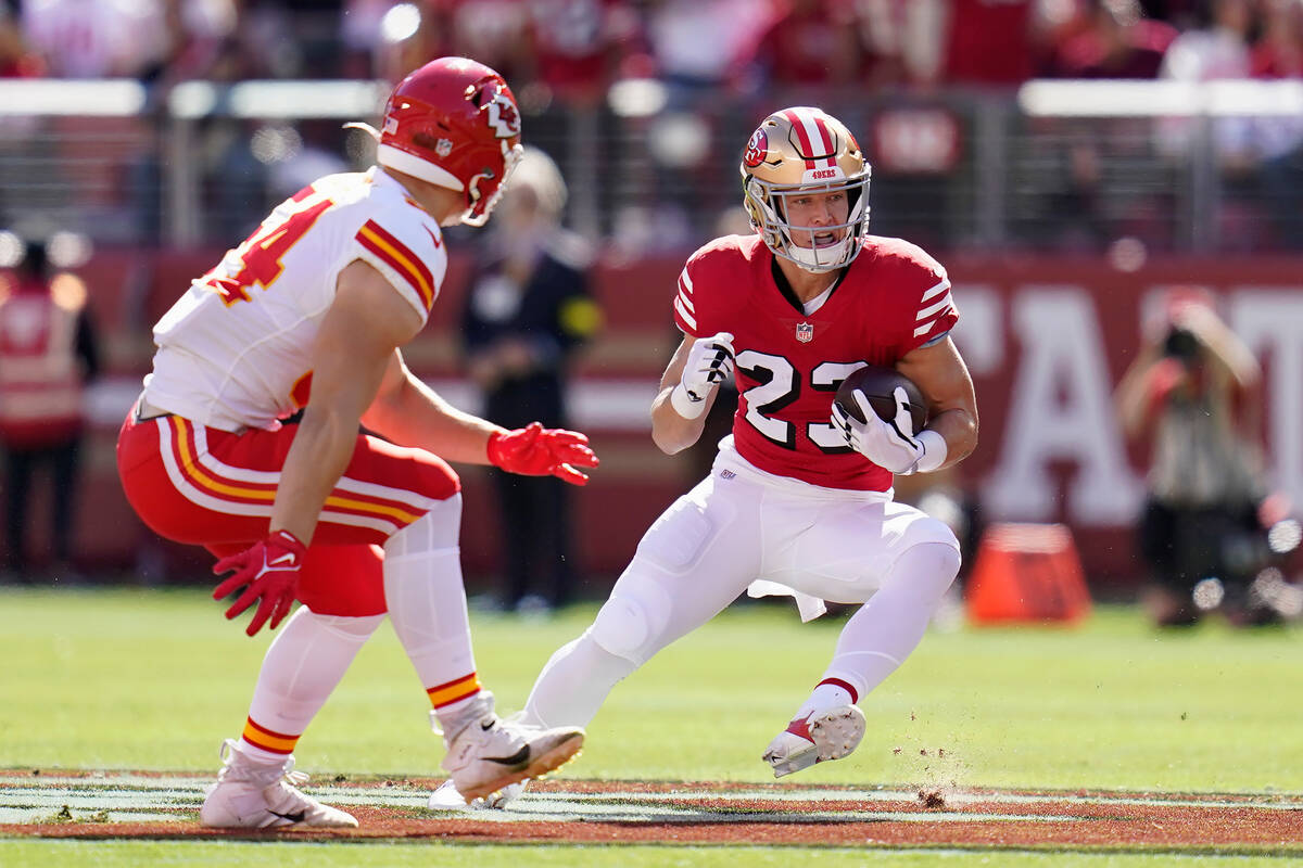 San Francisco 49ers running back Christian McCaffrey, right, runs against Kansas City Chiefs li ...