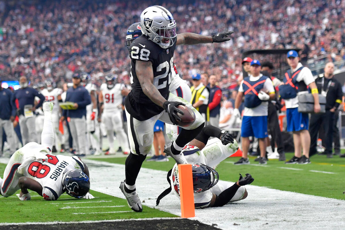 Las Vegas Raiders running back Josh Jacobs scores a touchdown during the second half of an NFL ...