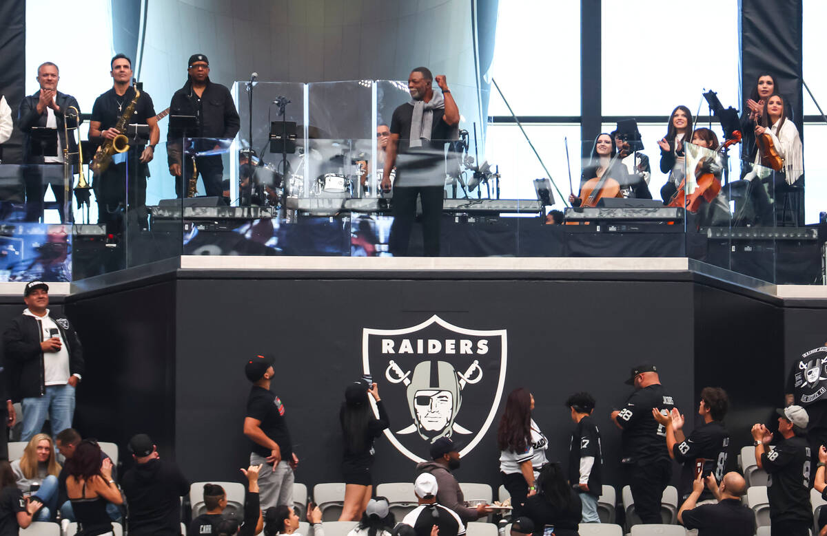 Actor and former Raider Carl Weathers lights the Al Davis Memorial Torch before an NFL game at ...