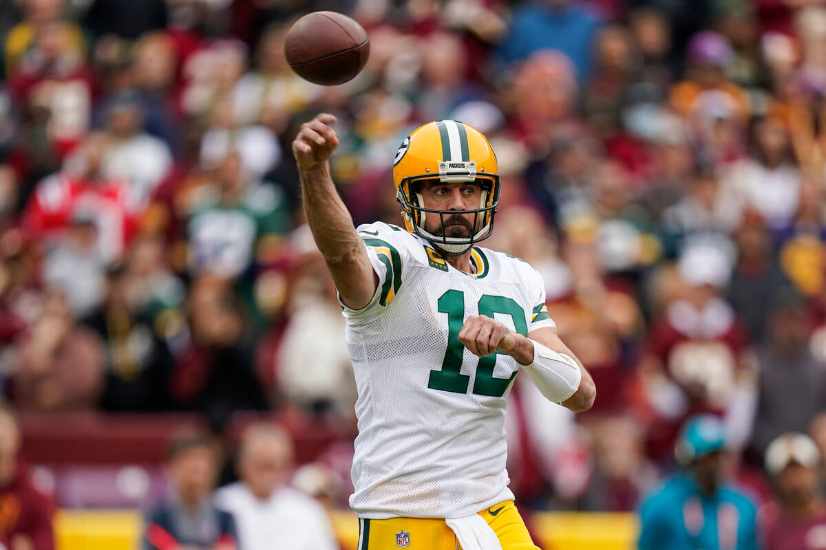 Green Bay Packers quarterback Aaron Rodgers (12) throws a pass during the first half of an NFL ...