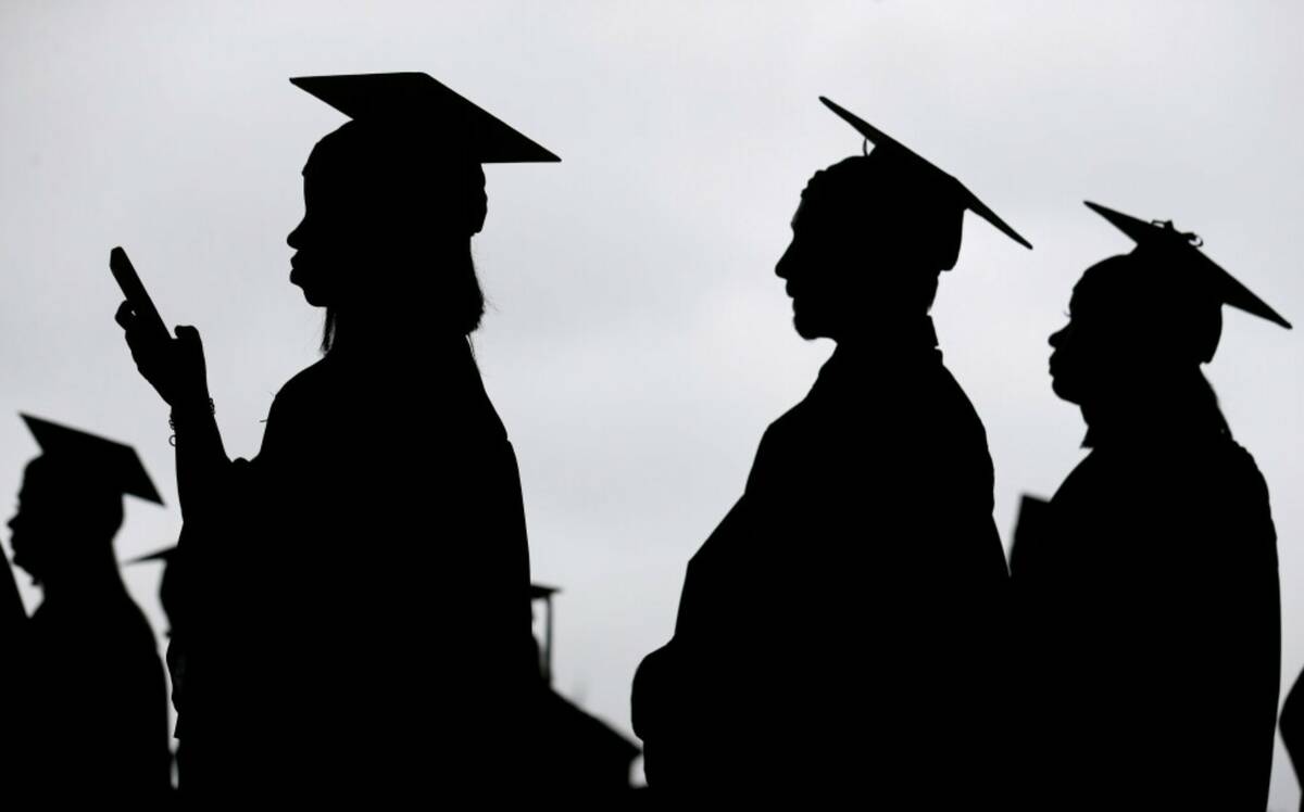 New graduates line up before the start of a community college commencement in East Rutherford, ...