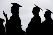 New graduates line up before the start of a community college commencement in East Rutherford, ...