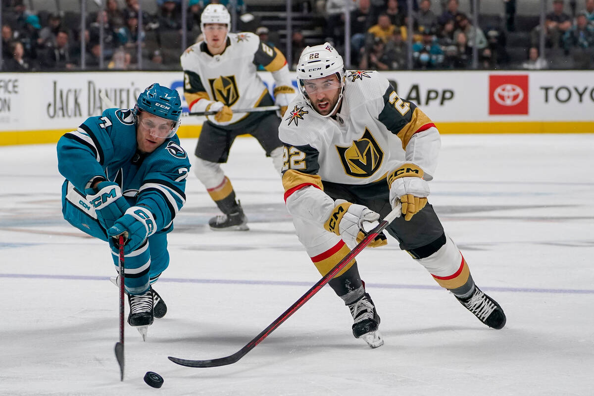 San Jose Sharks center Nico Sturm (7) and Vegas Golden Knights center Michael Amadio (22) chase ...