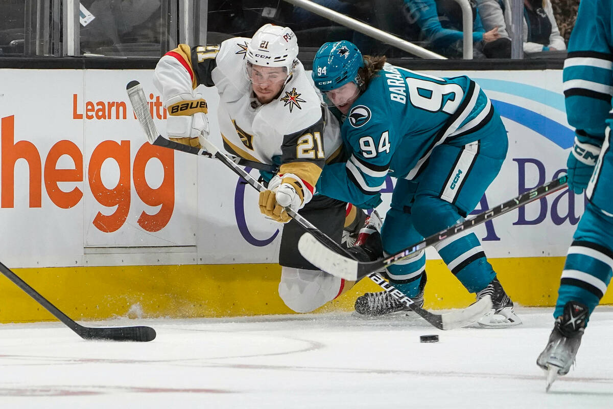 Vegas Golden Knights center Brett Howden (21) and San Jose Sharks left wing Alexander Barabanov ...