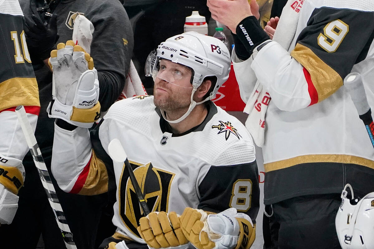 Vegas Golden Knights center Phil Kessel (8) waves to the crowd while being congratulated for pl ...