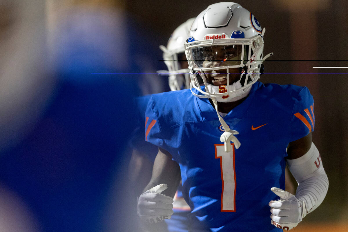 Bishop Gorman’s Zachariah Branch runs in after his team scored a touchdown during a high ...