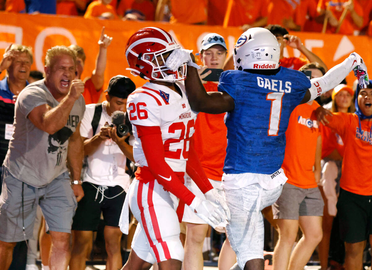 Bishop Gorman's wide receiver Zachariah Branch (1) blocks Mater Dei's defensive back Cory Lav ...