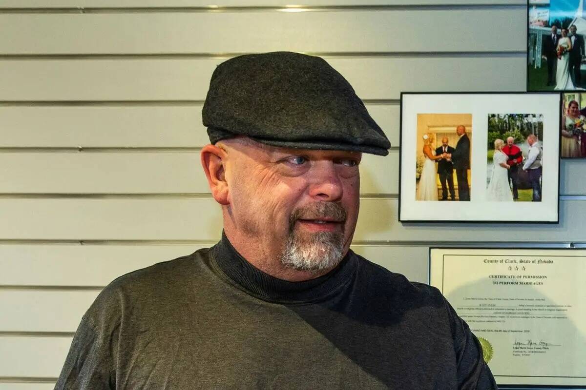 Gold & Silver Pawn Shop owner Rick Harrison, left, signs certificates for the Rev. Scott Polek ...