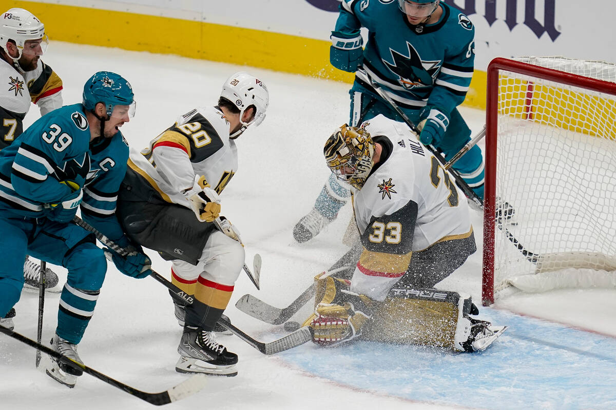 Vegas Golden Knights goaltender Adin Hill (33) stops a shot against the San Jose Sharks during ...