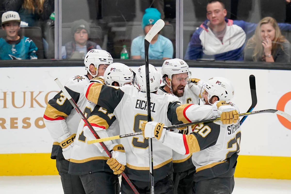 Vegas Golden Knights right wing Mark Stone, second from right, celebrates with teammates after ...