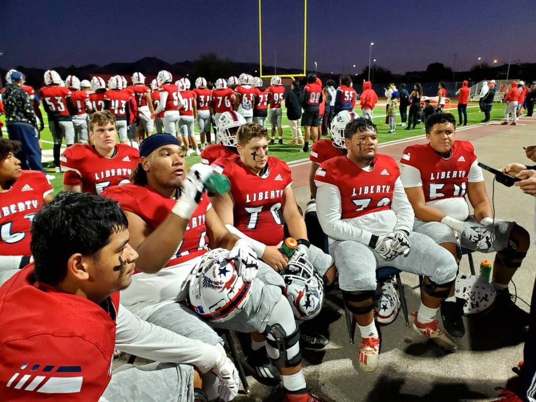 Liberty's offensive line on the sideline during the Patriots' playoff game against Foothill on ...