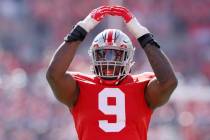 Ohio State defensive lineman Zach Harrison plays against Iowa during an NCAA college football g ...