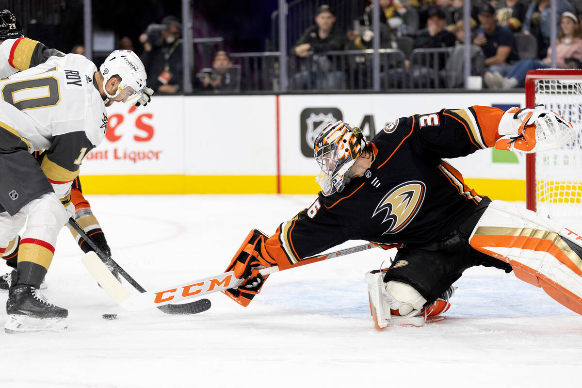 Ducks goaltender John Gibson (36) saves a shot on goal by Golden Knights center Nicolas Roy (10 ...