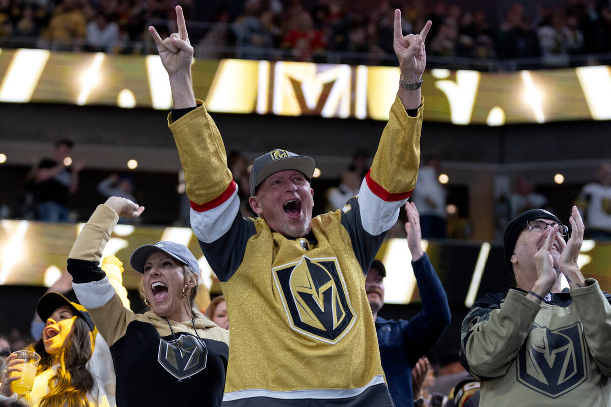 Golden Knights fans celebrate after Golden Knights center Chandler Stephenson (20) scored a goa ...