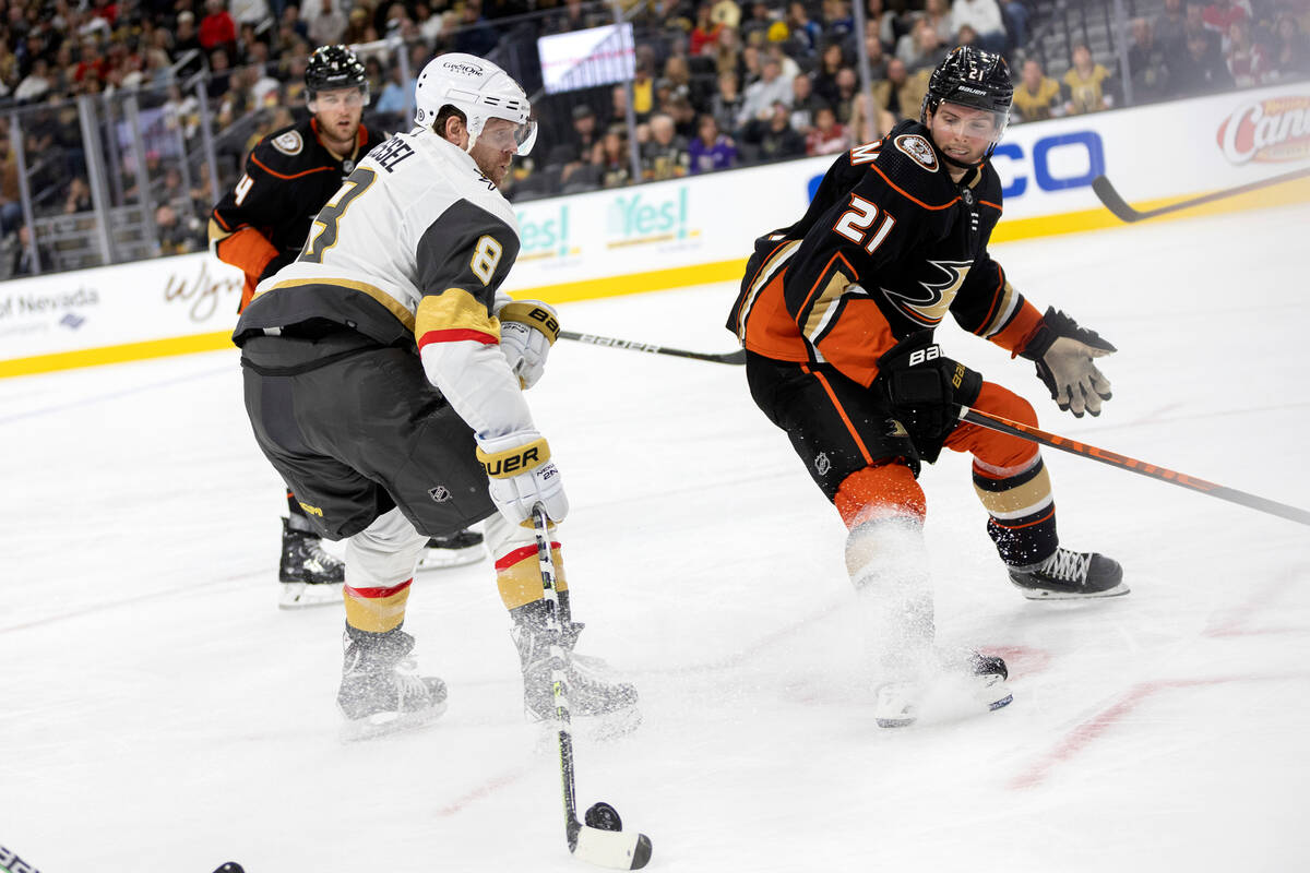 Golden Knights center Phil Kessel (8) goes for the net while Ducks defenseman Cam Fowler (4) an ...