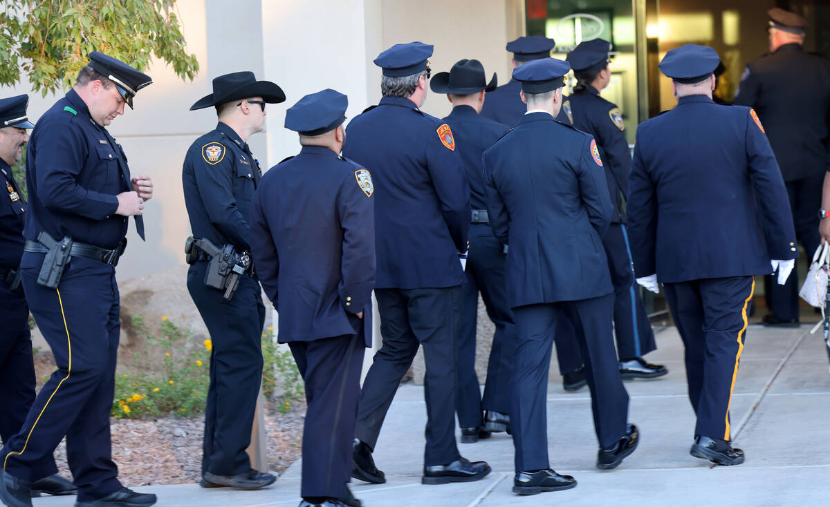Officers from across the country arrive during public visitation for fallen Las Vegas police of ...