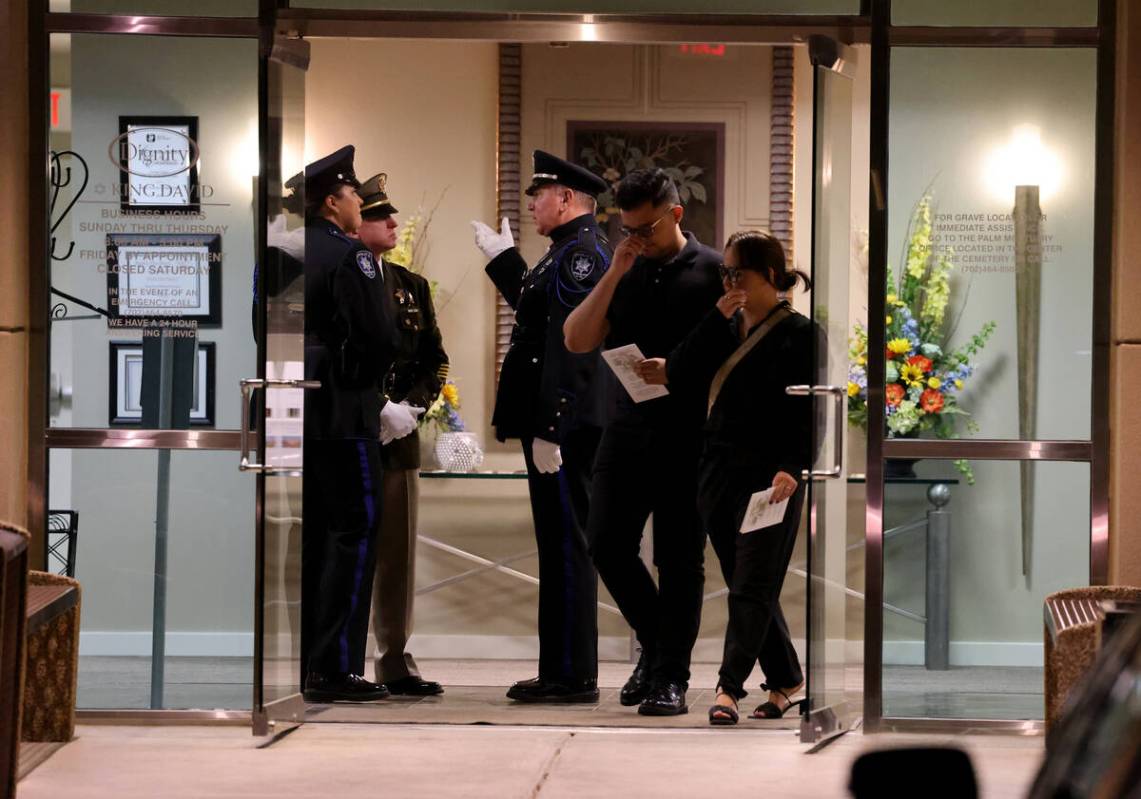 Mourners and officers during public visitation for fallen Las Vegas police officer Truong Thai ...