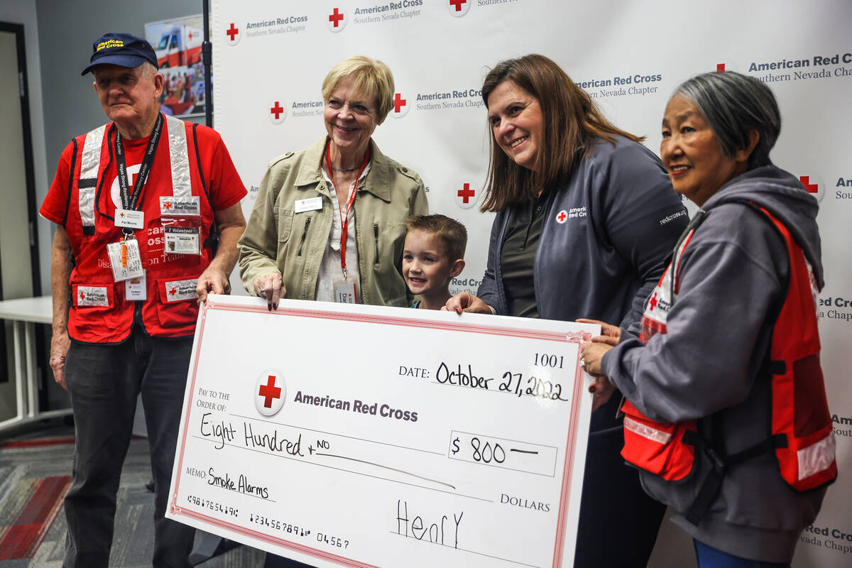 Red Cross volunteers Pat Moore, from left, Diane Orgill, Red Cross Executive Director Rachel Fl ...