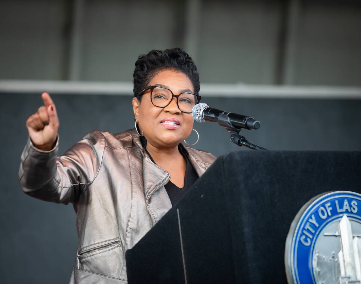 Carol Peterson speaks during a block party event commemorating her father’s legacy on Th ...