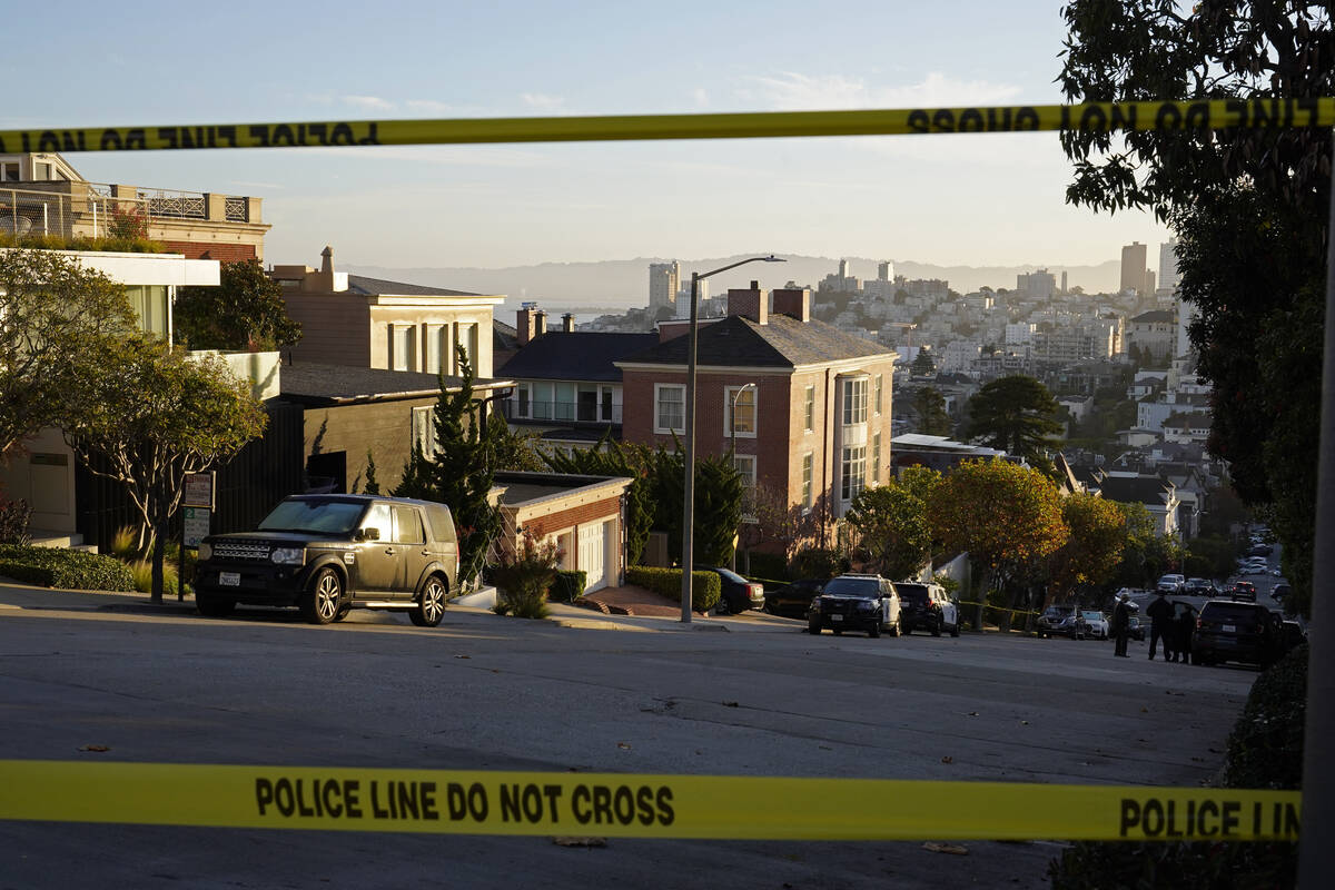 Police tape blocks a street outside the home of Paul Pelosi, the husband of House Speaker Nancy ...