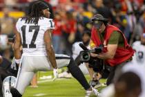 Raiders wide receiver Davante Adams (17) is filmed by an NFL videographer before an NFL game ag ...
