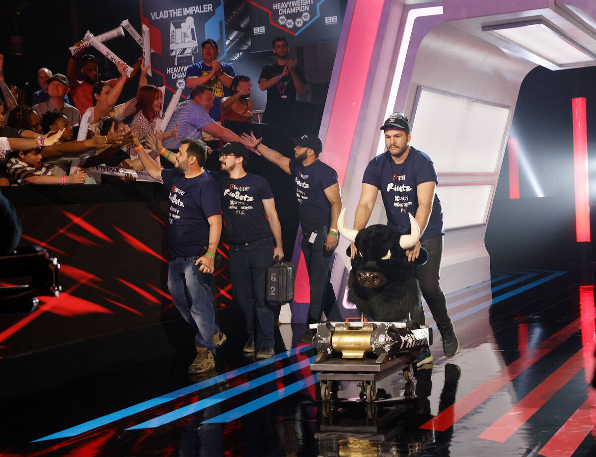 RioBotz team members of Rio de Janeiro, Brazil enter the BattleBots arena with their robot Mino ...