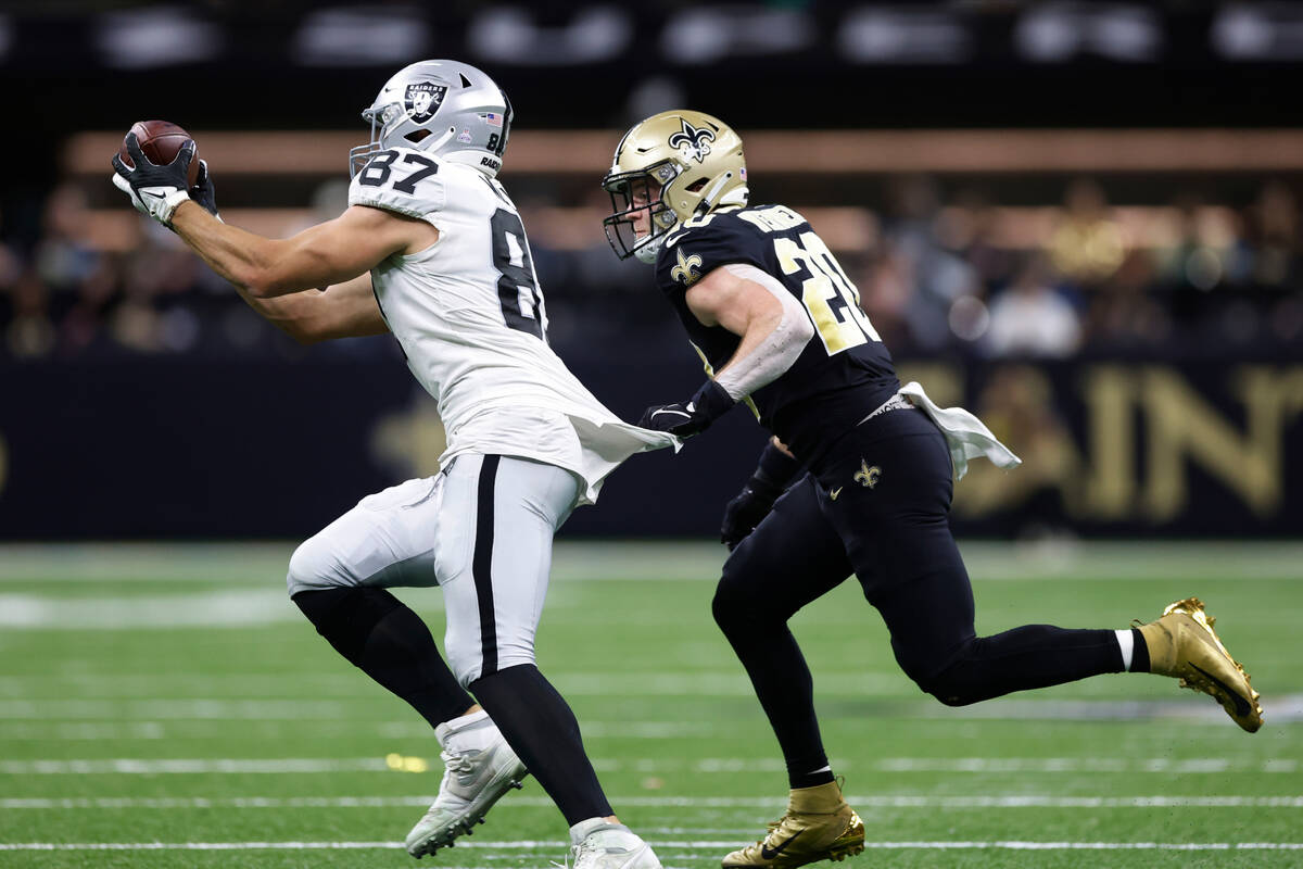 Las Vegas Raiders tight end Foster Moreau (87) makes a catch against New Orleans Saints linebac ...