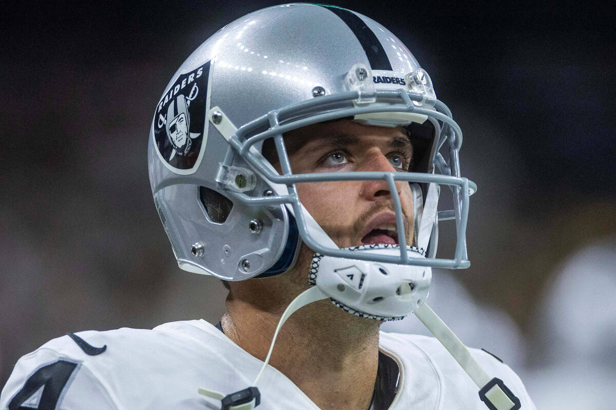 Raiders quarterback Derek Carr (4) watches the replay screen versus the New Orleans Saints duri ...