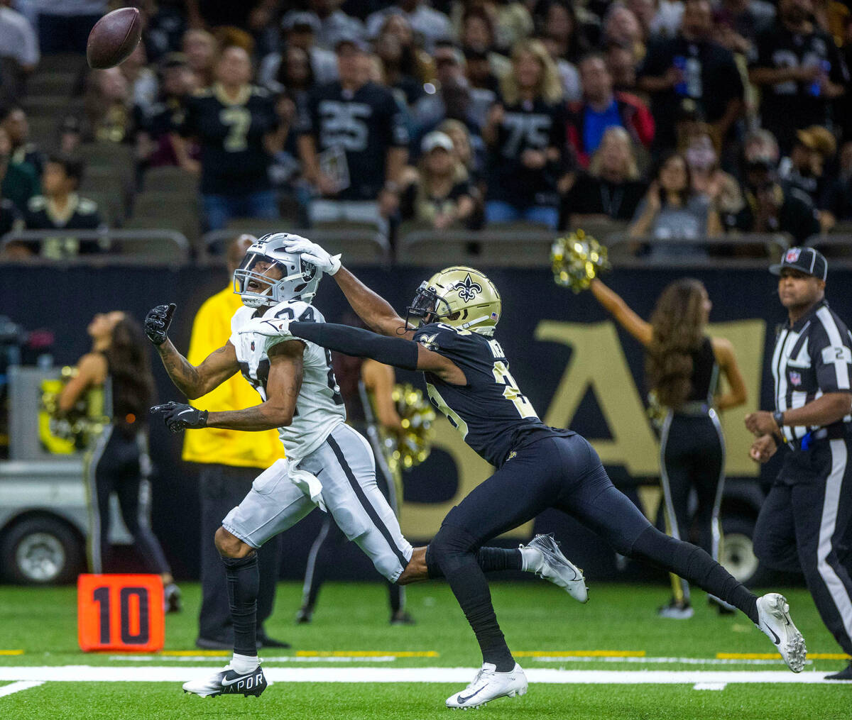 Raiders wide receiver Keelan Cole (84) is overthrown on a long pass with New Orleans Saints run ...