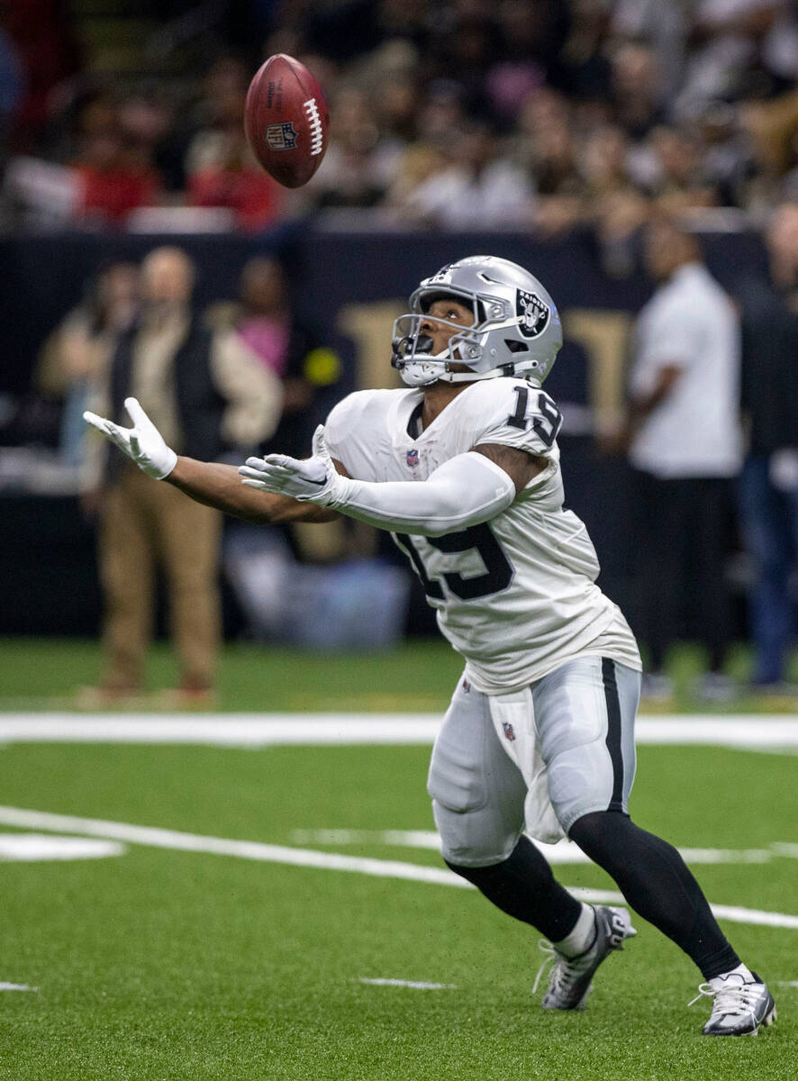 Raiders wide receiver DJ Turner (19) mishandles the football on a kick return during the first ...
