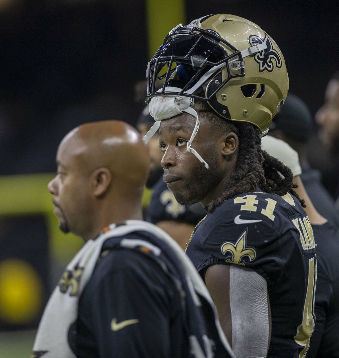 New Orleans Saints running back Alvin Kamara (41), right, looks on from the during the first ha ...