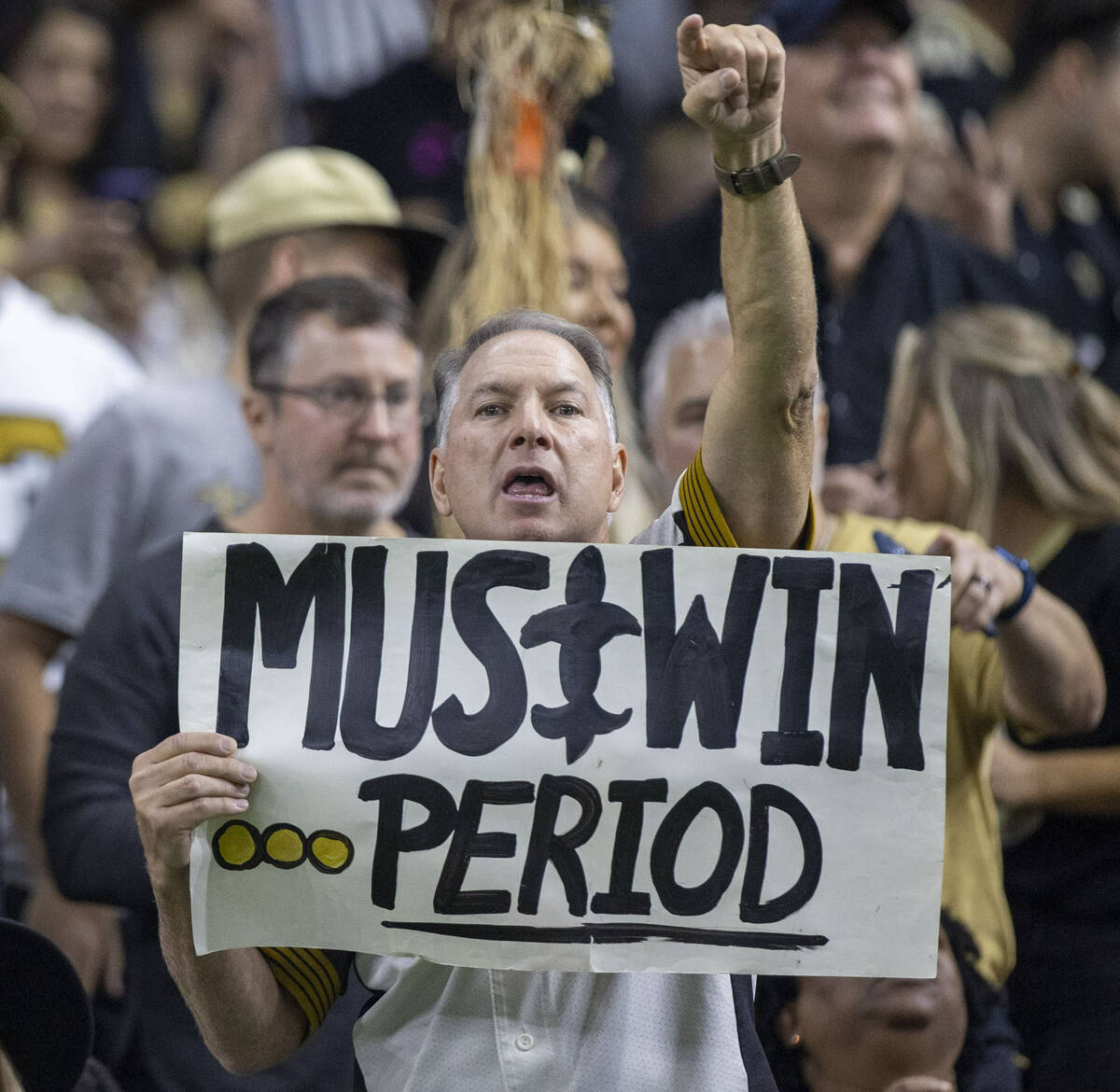 A New Orleans Saints fan holds up a sign during the second half of an NFL game against the Raid ...